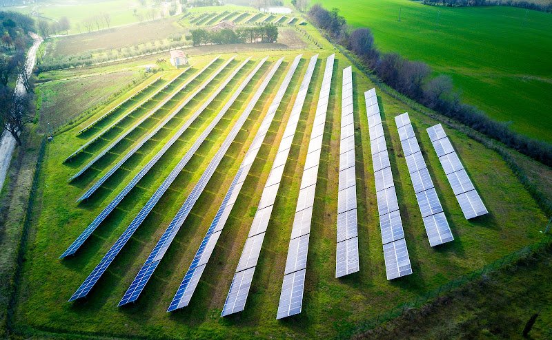 aerial view of solar panels on a sunny day. power farm producing clean energy